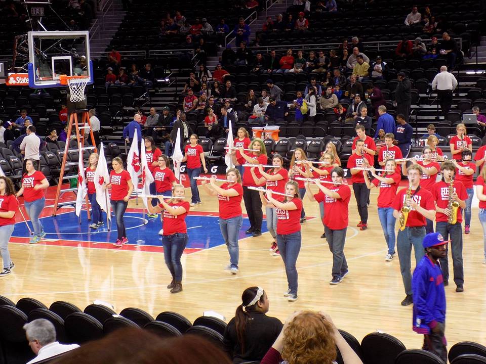Band members performing at a Detroit Pistons Game