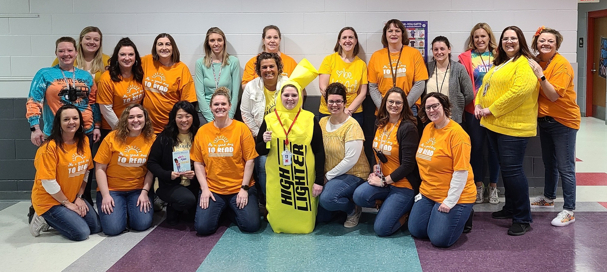 DEL staff with shirts that say "it's a good day to Read"