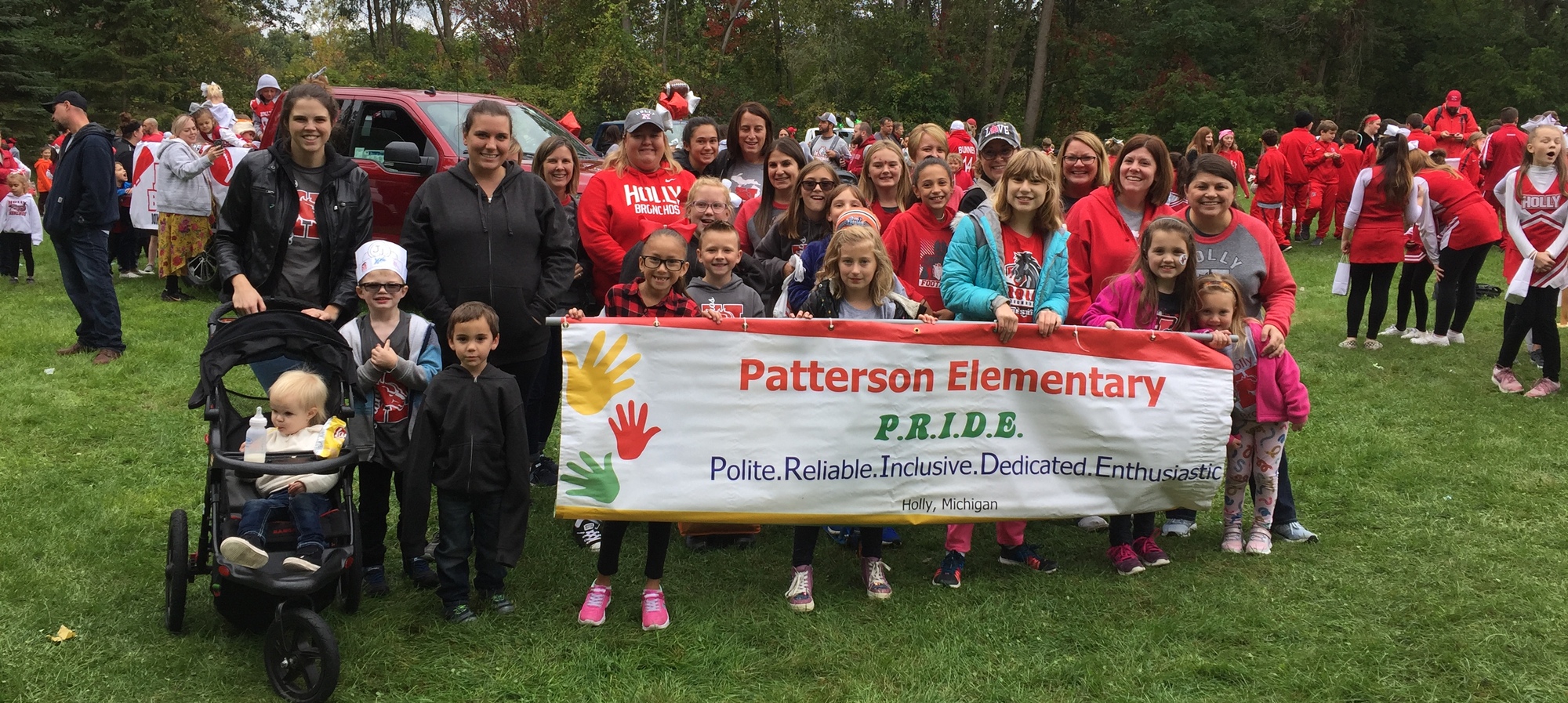 Patterson Pride banner with staff, students and parents