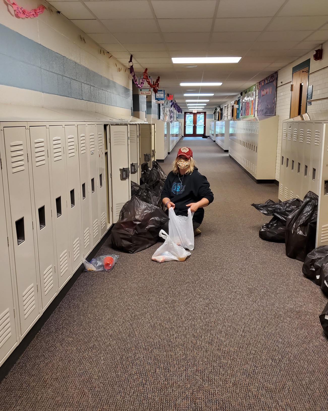 Staff emptying lockers for student pickup