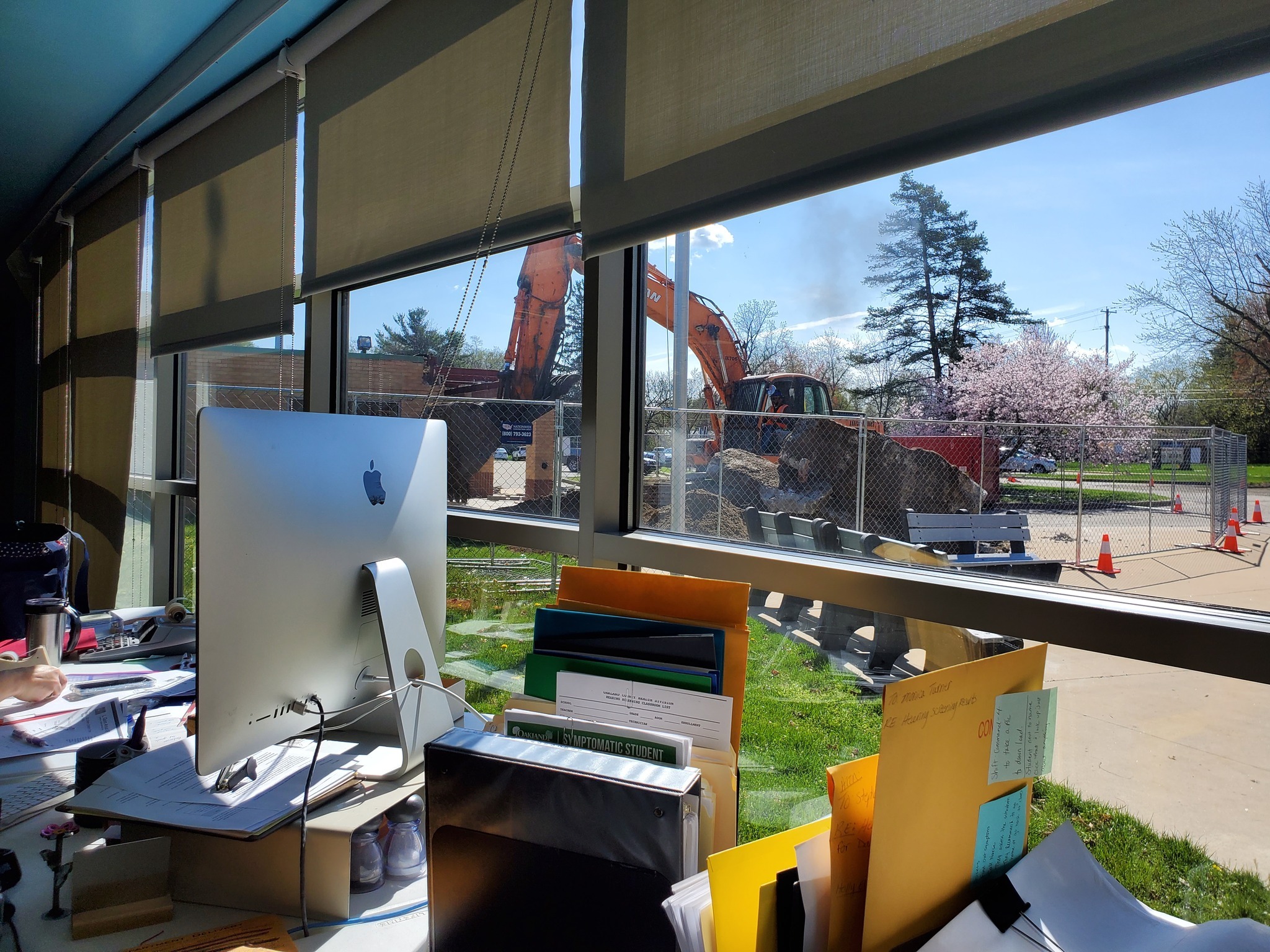 View of construction equipment from the windows in the library (temporary office)