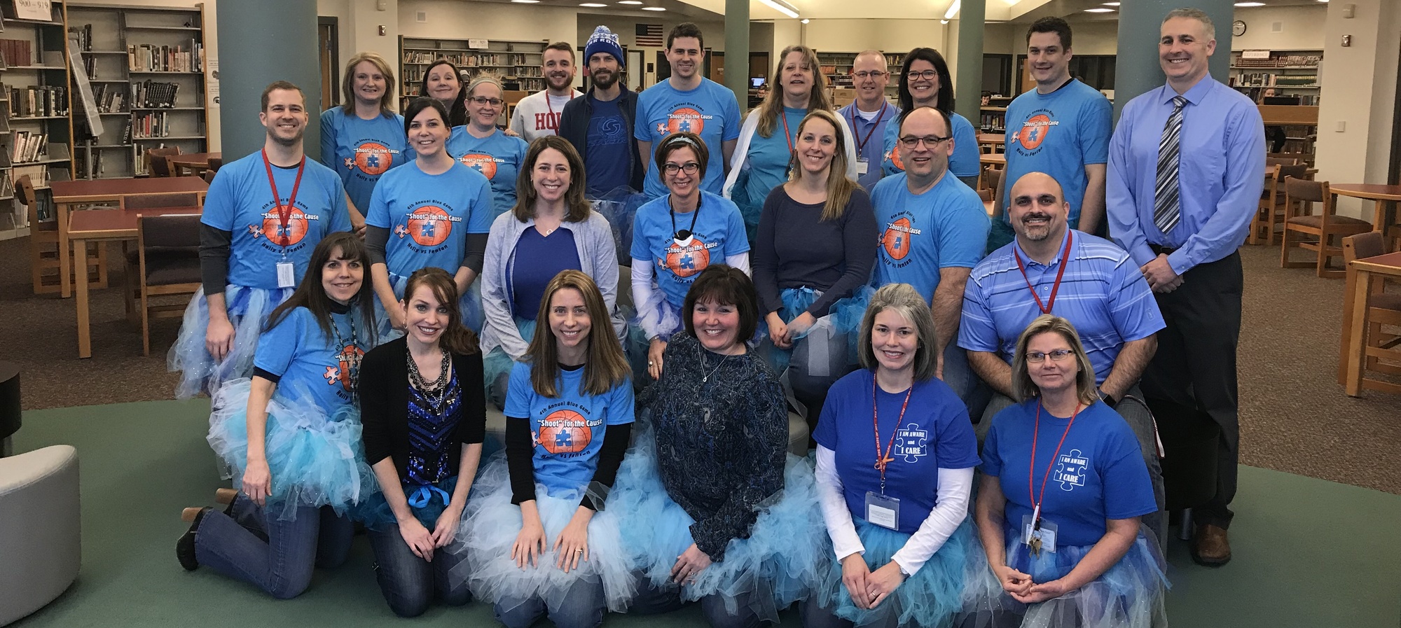 HHS staff supporting Autism Awareness wearing their blue shirts and blue tutus