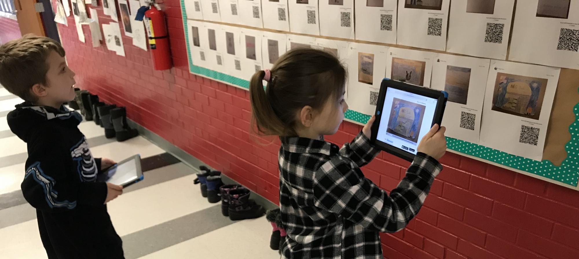 Students created QR codes and now everyone who visits the second grade hallway can listen to their writing.
