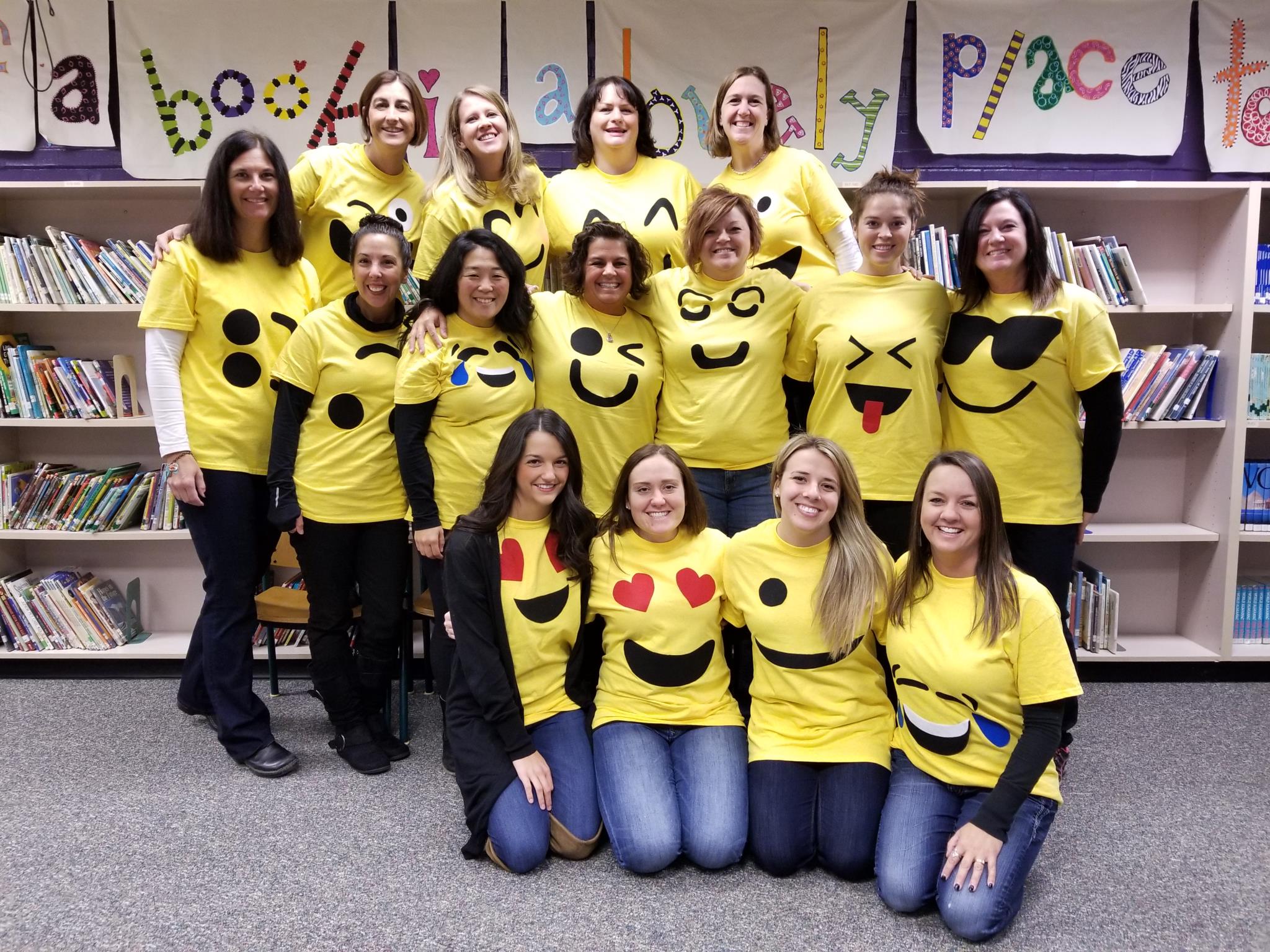 Davisburg staff dressed in emoji shirts