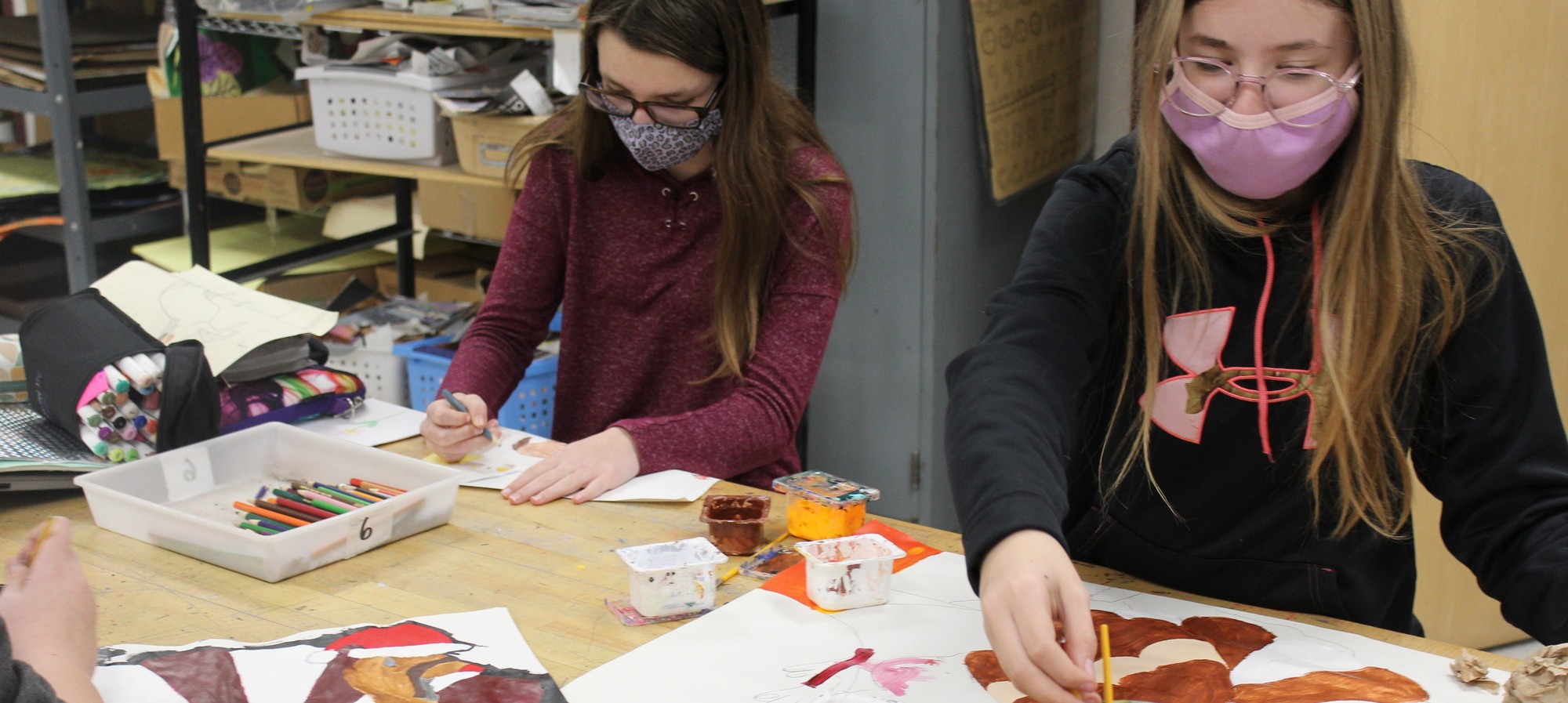 Two female students in art class
