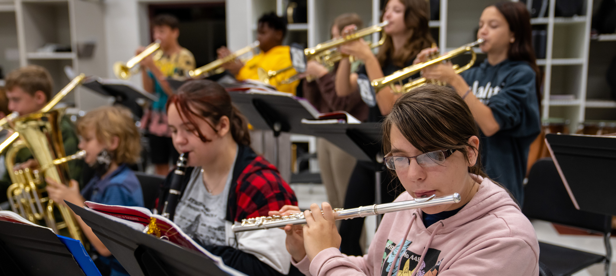 Students playing instruments in band class