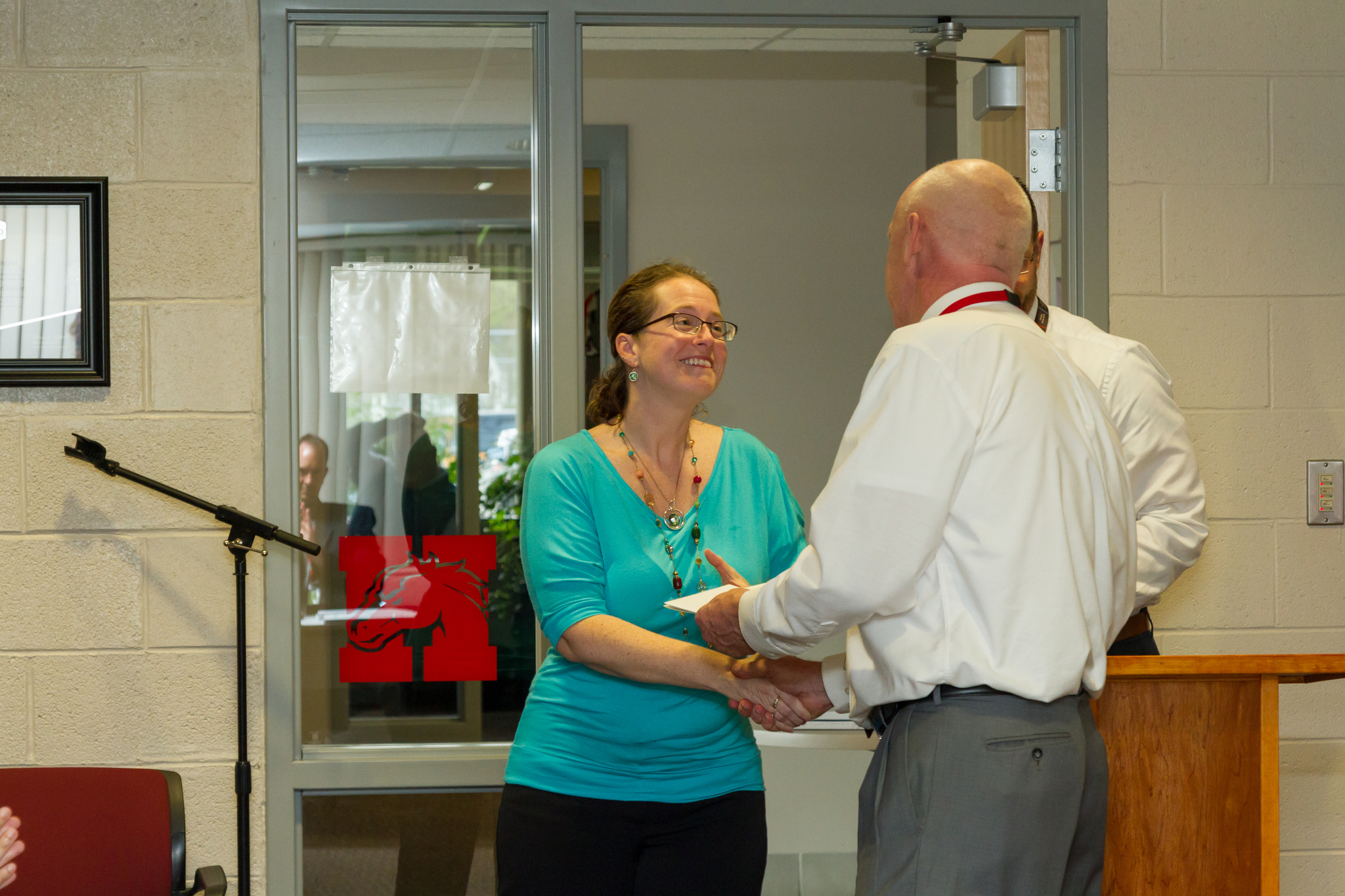 Ms. Jensen receiving her award from Mr. Curl