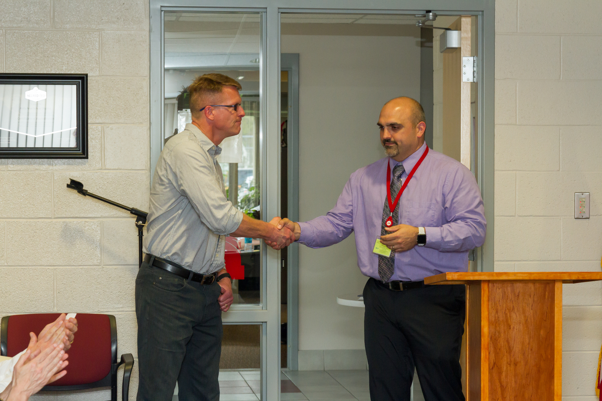 Mr. Millhouse receiving his award with Mr. Lofiego