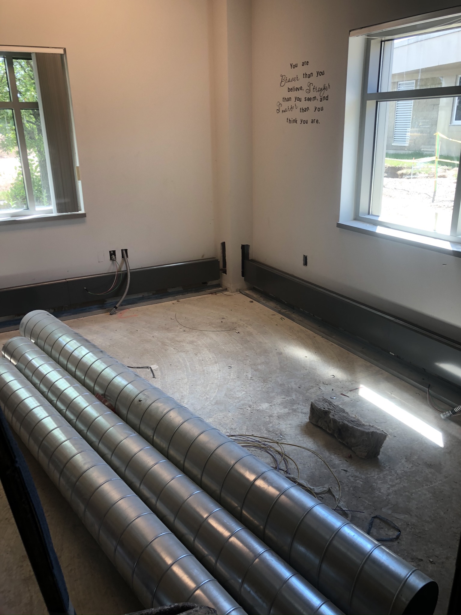 Air handling pipes on the floor in the main office area