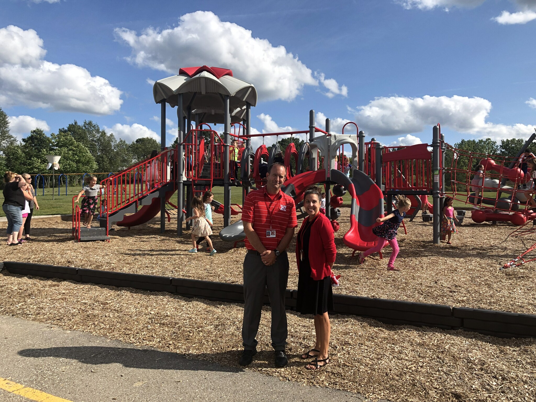 Mr Roper and Mrs Kott in front of the new playground