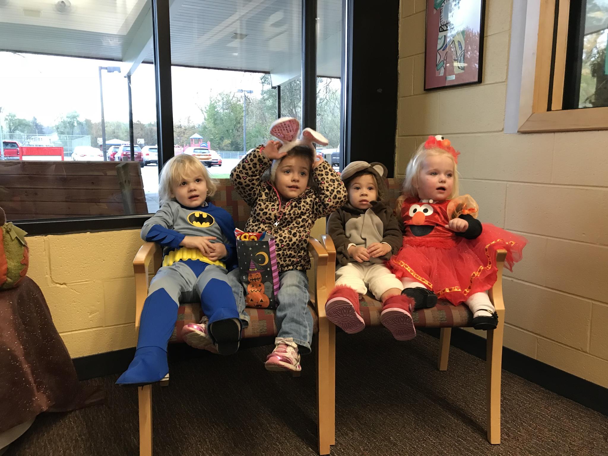 Early On students in costume - batman, a bunny, a monkey, elmo