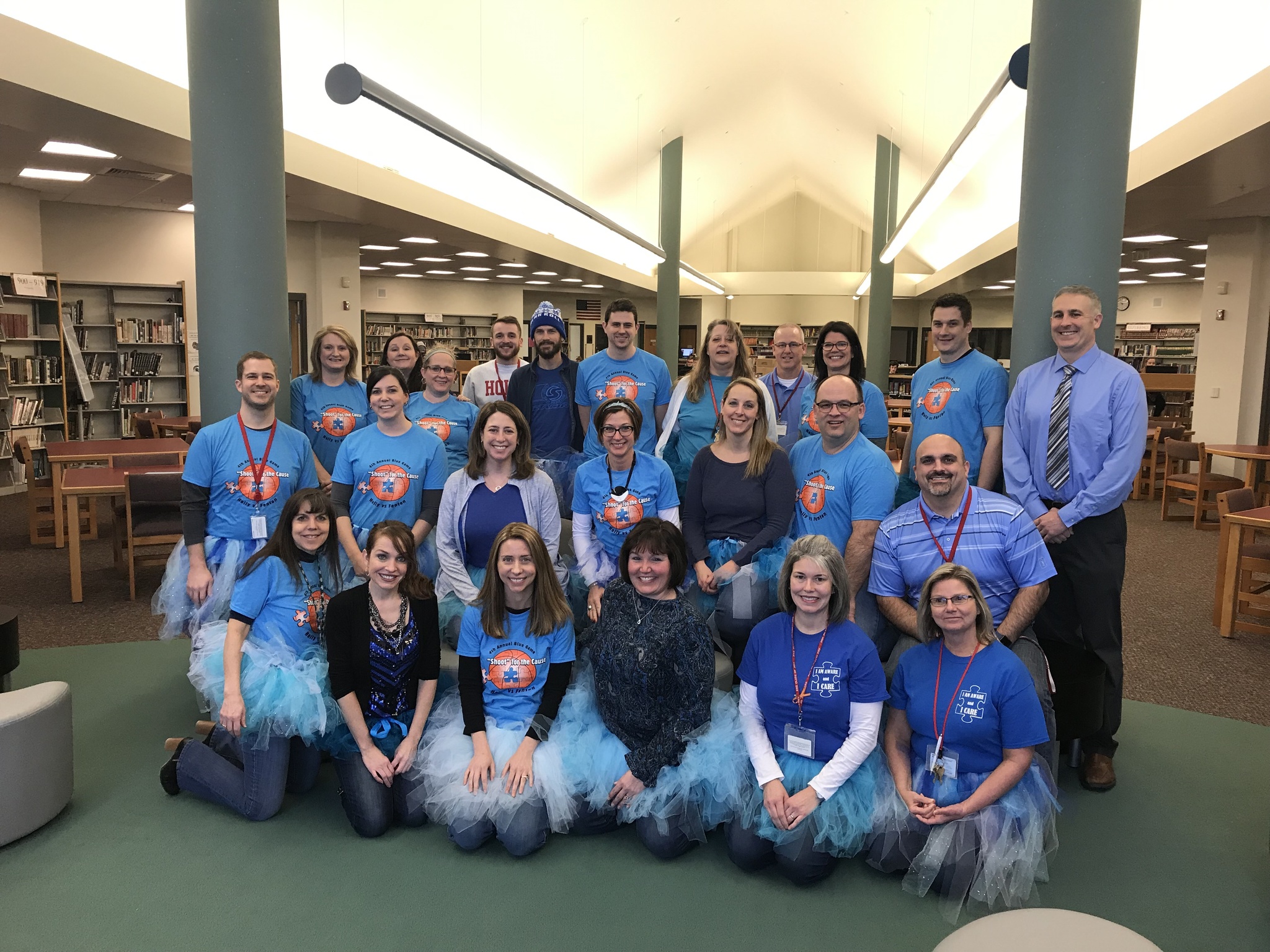Staff at HHS in their blue shirts and tutus