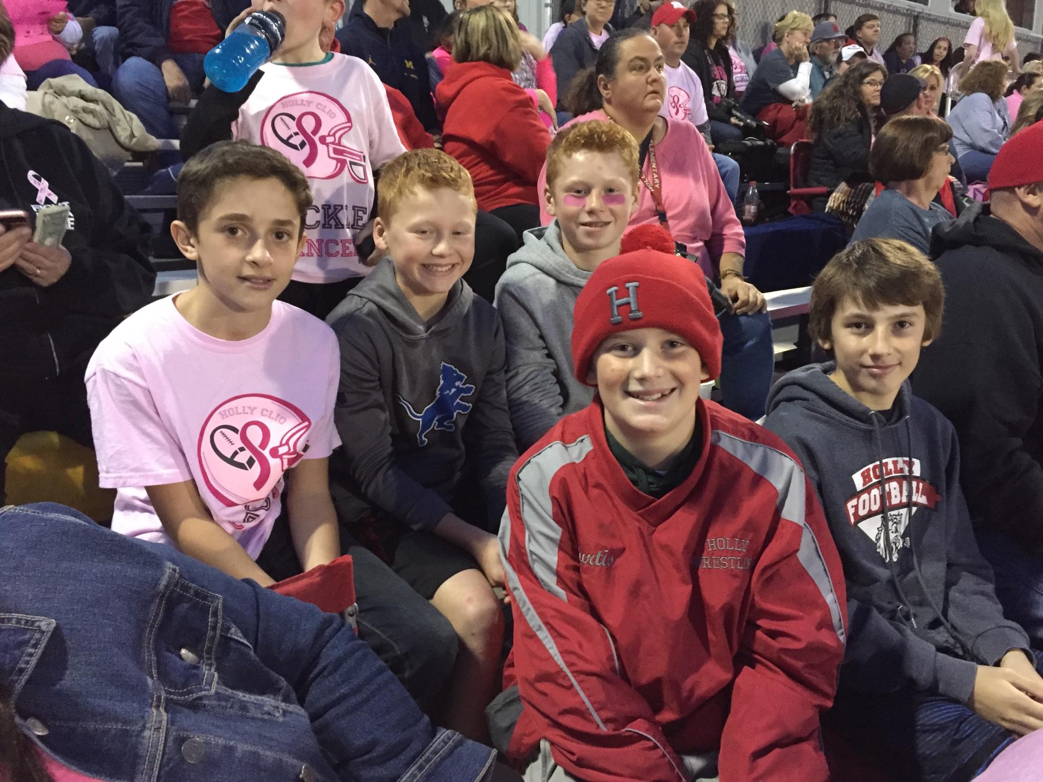 Boys at the pink football game