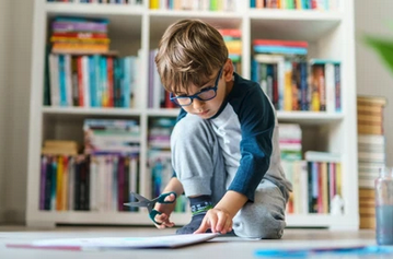 4 year old little boy with books