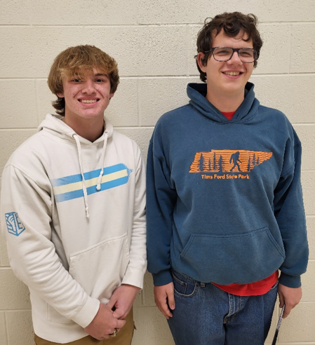 Holly High School sophomore percussionist Bradlee Coggins, left, and Holly High School junior and trombonist Will Raleigh
